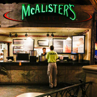 Mccalisters hours McAlister’s Deli History. McAlister’s Deli was founded in in Oxford, Mississippi by Dr. Don Newcomb, a retired dentist. The original restaurant was opened in a renovated gas station and some of those original design elements are still incorporated into the design of the restaurants, such as garage door and black and white tile.