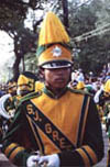 A High School Band Member Marches in a Mardi Gras Parade