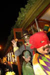 Costumed Revelers Boarding a Streetcar
